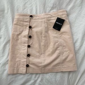 Blush pink suede button front skirt